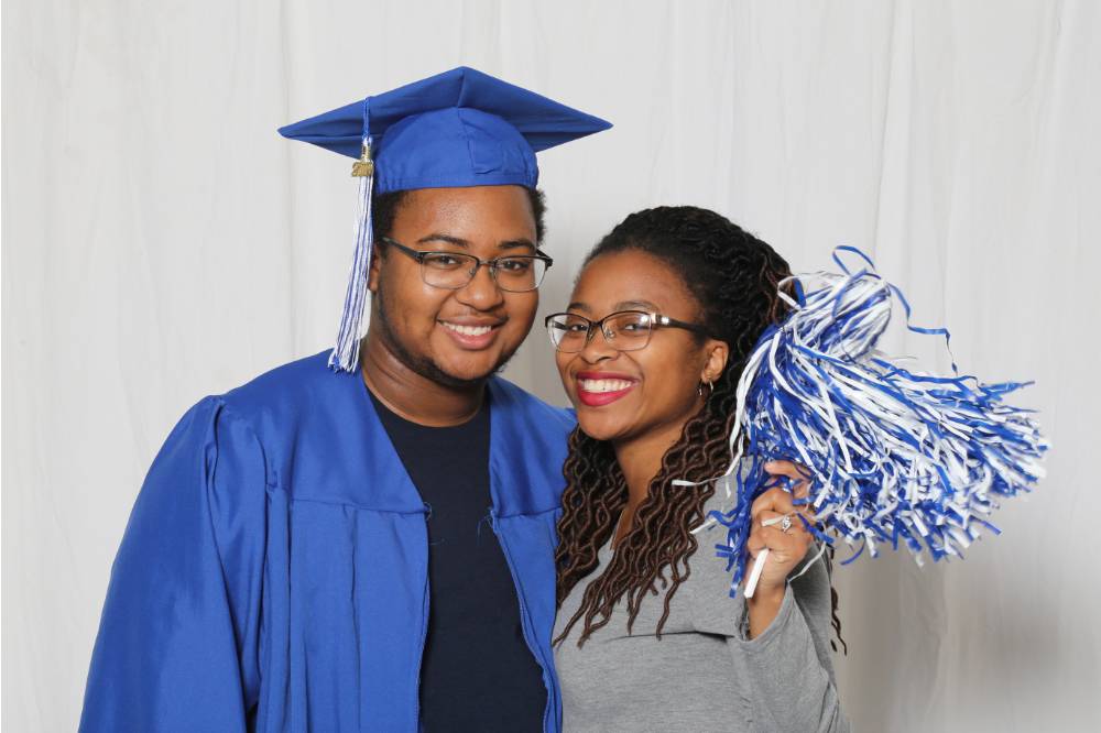 guy with girl in cap and gown